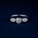 Load image into Gallery viewer, Refined White Gold Trio Ring with Bezel-Set Centerpiece and Tapered Side Brilliance
